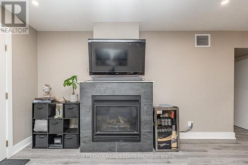 102 - 4 Tree Tops Lane, Huntsville, ON - Indoor Photo Showing Living Room With Fireplace