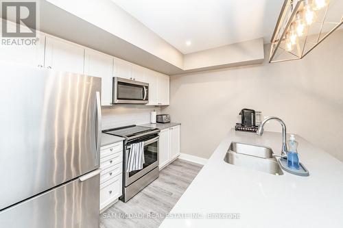 102 - 4 Tree Tops Lane, Huntsville, ON - Indoor Photo Showing Kitchen With Double Sink