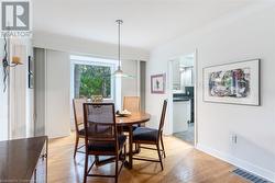 Dining area with light hardwood / wood-style floors - 