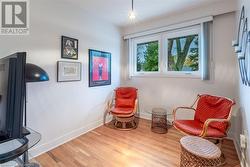 Sitting room featuring light wood-type flooring - 