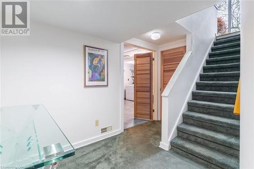 Stairway featuring carpet and washer / clothes dryer - 103 Mcgregor Crescent, Ancaster, ON - Indoor Photo Showing Other Room