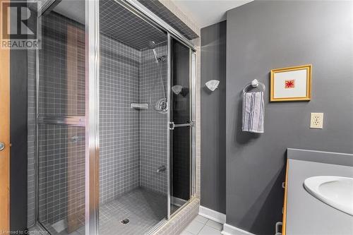 Bathroom featuring tile patterned floors, a shower with door, and sink - 103 Mcgregor Crescent, Ancaster, ON - Indoor Photo Showing Bathroom