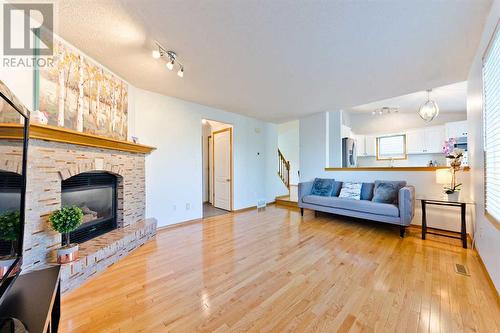 145 Macewan Park Rise Nw, Calgary, AB - Indoor Photo Showing Living Room With Fireplace