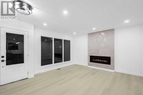 7915 Huntington Street Ne, Calgary, AB - Indoor With Fireplace