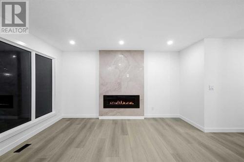 7915 Huntington Street Ne, Calgary, AB - Indoor With Fireplace