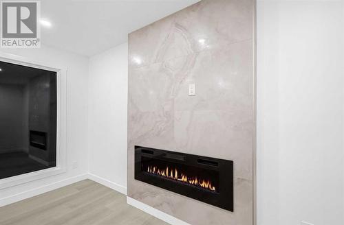 7915 Huntington Street Ne, Calgary, AB - Indoor Photo Showing Living Room With Fireplace