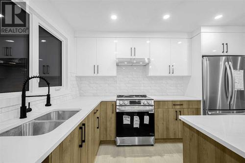 7915 Huntington Street Ne, Calgary, AB - Indoor Photo Showing Kitchen With Double Sink With Upgraded Kitchen