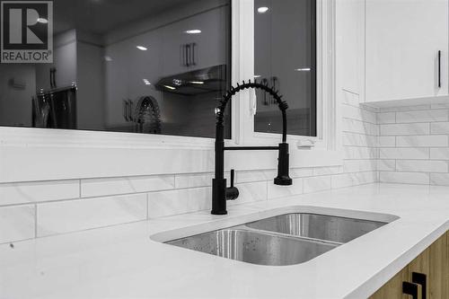 7915 Huntington Street Ne, Calgary, AB - Indoor Photo Showing Kitchen With Double Sink