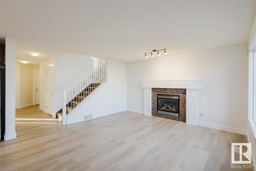 8017 Shaske Dr Nw, Edmonton, AB - Indoor Photo Showing Living Room With Fireplace