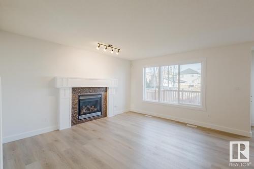 8017 Shaske Dr Nw, Edmonton, AB - Indoor Photo Showing Living Room With Fireplace