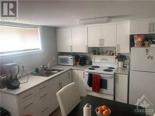 SDU renovated white kitchen - 210 Harcourt Avenue, Ottawa, ON - Indoor Photo Showing Kitchen With Double Sink