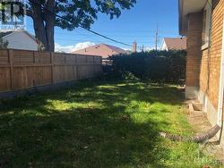 fenced backyard with a shed - 