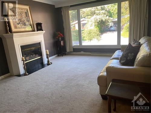 living room with gas fireplace - 210 Harcourt Avenue, Ottawa, ON - Indoor Photo Showing Other Room With Fireplace