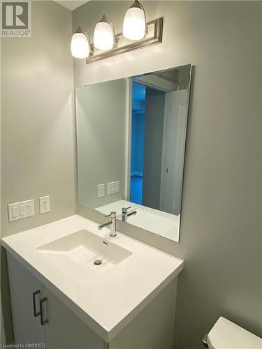 Bathroom featuring vanity and toilet - 128 Grovewood Common Unit# 117, Oakville, ON - Indoor Photo Showing Bathroom