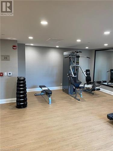 Exercise area featuring light wood-type flooring - 128 Grovewood Common Unit# 117, Oakville, ON - Indoor Photo Showing Gym Room