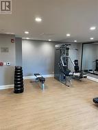 Exercise area featuring light wood-type flooring - 