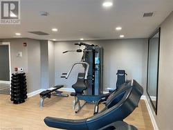 Exercise room featuring light hardwood / wood-style flooring - 