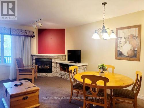 2138-39 - 90 Highland Drive, Oro-Medonte, ON - Indoor Photo Showing Dining Room With Fireplace