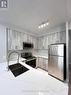 202 - 225 Webb Drive, Mississauga, ON  - Indoor Photo Showing Kitchen With Double Sink 