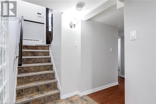 Stairway with hardwood / wood-style flooring - 15 Empress Avenue, Hamilton, ON 