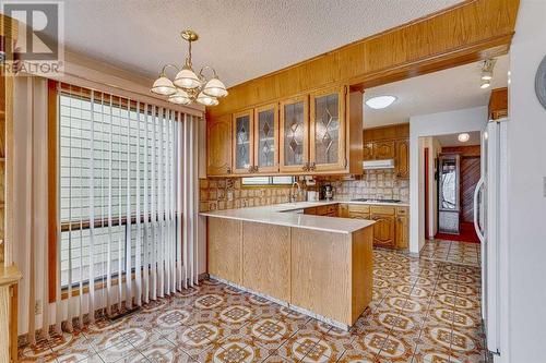 84 Range Way Nw, Calgary, AB - Indoor Photo Showing Kitchen