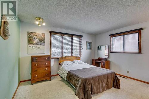 84 Range Way Nw, Calgary, AB - Indoor Photo Showing Bedroom