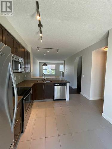 105 Sherwood Row Nw, Calgary, AB - Indoor Photo Showing Kitchen With Stainless Steel Kitchen With Double Sink