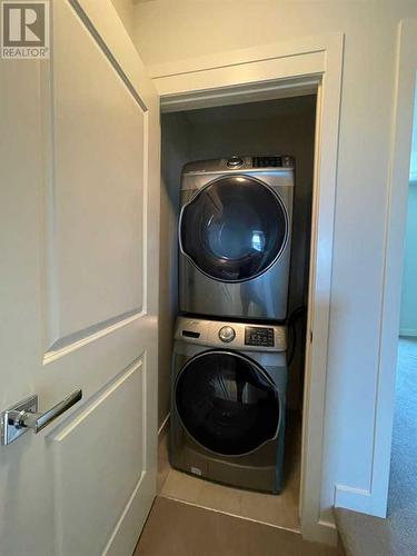 105 Sherwood Row Nw, Calgary, AB - Indoor Photo Showing Laundry Room