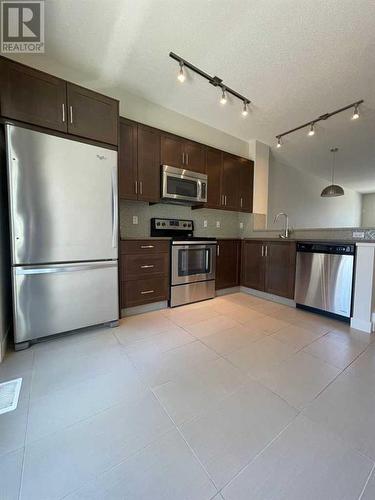 105 Sherwood Row Nw, Calgary, AB - Indoor Photo Showing Kitchen With Stainless Steel Kitchen