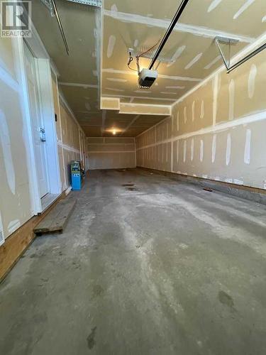 105 Sherwood Row Nw, Calgary, AB - Indoor Photo Showing Garage