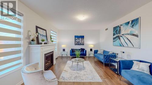 39 Hollingshead Road, Ingersoll, ON - Indoor Photo Showing Living Room With Fireplace