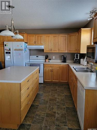 525 Carlyle Avenue, Carlyle, SK - Indoor Photo Showing Kitchen With Double Sink