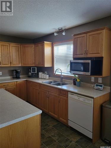 525 Carlyle Avenue, Carlyle, SK - Indoor Photo Showing Kitchen With Double Sink