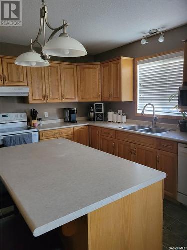 525 Carlyle Avenue, Carlyle, SK - Indoor Photo Showing Kitchen With Double Sink