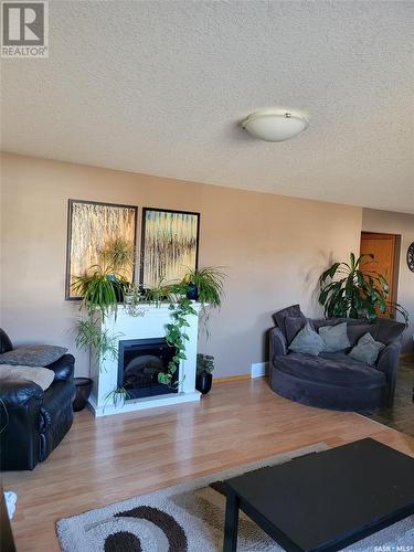 525 Carlyle Avenue, Carlyle, SK - Indoor Photo Showing Living Room With Fireplace