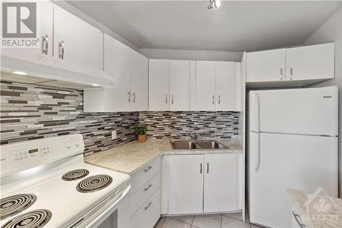 2000 Jasmine Crescent Unit#718, Ottawa, ON - Indoor Photo Showing Kitchen With Double Sink