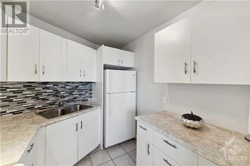 2000 Jasmine Crescent Unit#718, Ottawa, ON - Indoor Photo Showing Kitchen With Double Sink