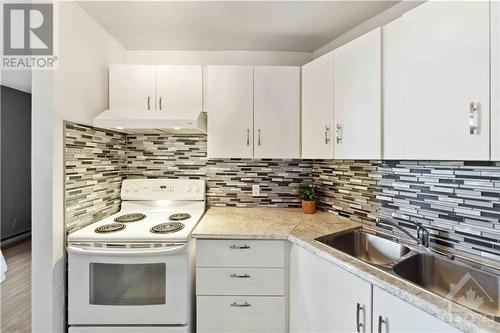 2000 Jasmine Crescent Unit#718, Ottawa, ON - Indoor Photo Showing Kitchen With Double Sink