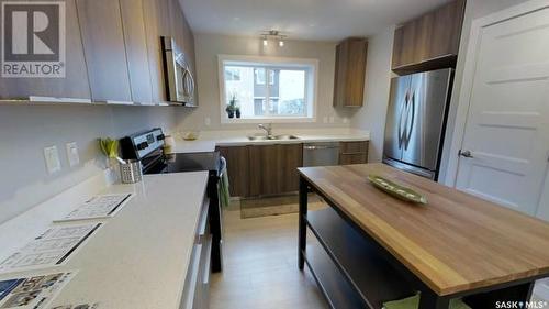 1 1070 Parr Hill Drive, Martensville, SK - Indoor Photo Showing Kitchen With Double Sink