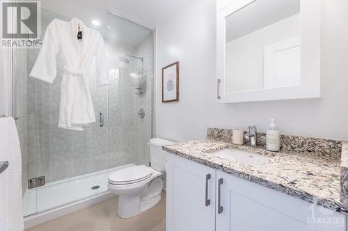 Quartz counter, ceramic tiles. Honeycomb tiles in shower. - 805 Carling Avenue Unit#708, Ottawa, ON - Indoor Photo Showing Bathroom