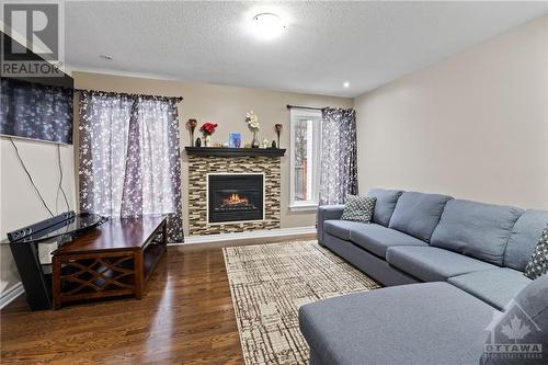 780 White Alder Avenue, Ottawa, ON - Indoor Photo Showing Living Room With Fireplace