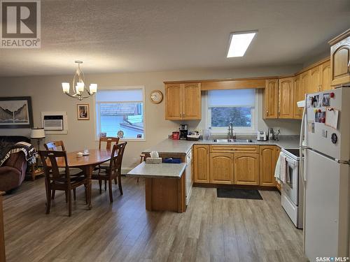 202 304 3Rd Avenue E, Watrous, SK - Indoor Photo Showing Kitchen With Double Sink