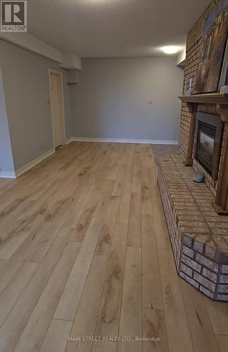 Bsmt - 54 Fox Run Lane, Bradford West Gwillimbury, ON - Indoor Photo Showing Other Room With Fireplace