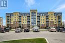 1419 Costigan Road Unit# 210, Milton, ON  - Outdoor With Balcony With Facade 