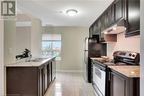 1419 Costigan Road Unit# 210, Milton, ON - Indoor Photo Showing Kitchen With Double Sink