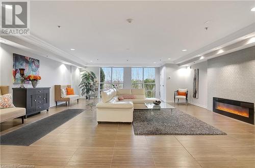 1419 Costigan Road Unit# 210, Milton, ON - Indoor Photo Showing Living Room With Fireplace