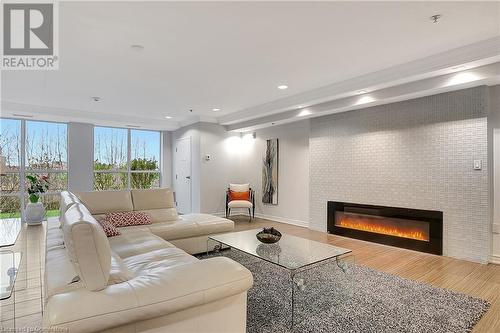 1419 Costigan Road Unit# 210, Milton, ON - Indoor Photo Showing Living Room With Fireplace