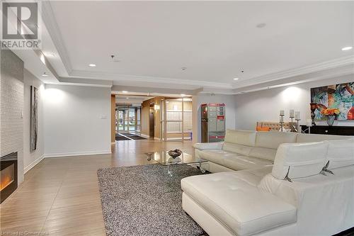 1419 Costigan Road Unit# 210, Milton, ON - Indoor Photo Showing Living Room With Fireplace