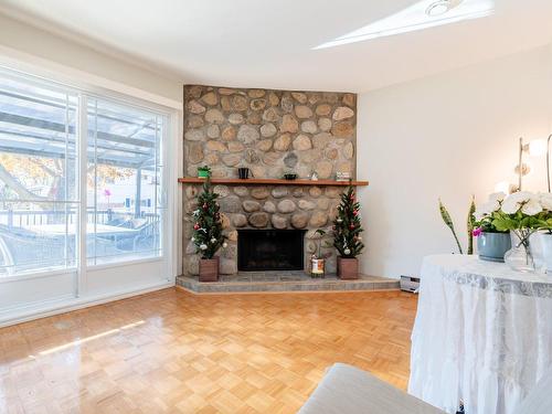 Family room - 1675 Crois. Sauvé, Brossard, QC - Indoor Photo Showing Living Room With Fireplace