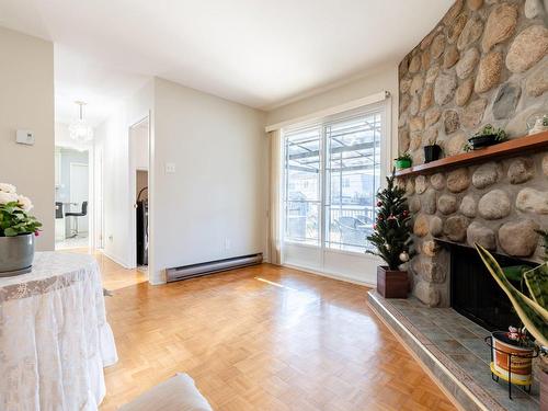 Family room - 1675 Crois. Sauvé, Brossard, QC - Indoor Photo Showing Living Room With Fireplace